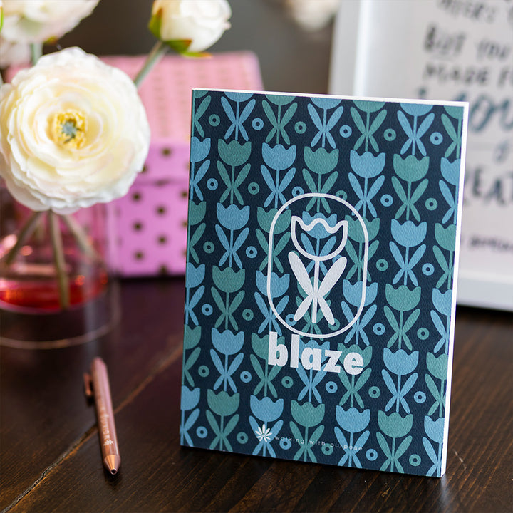 BLAZE Belong Prayer Journal on table with flowers
