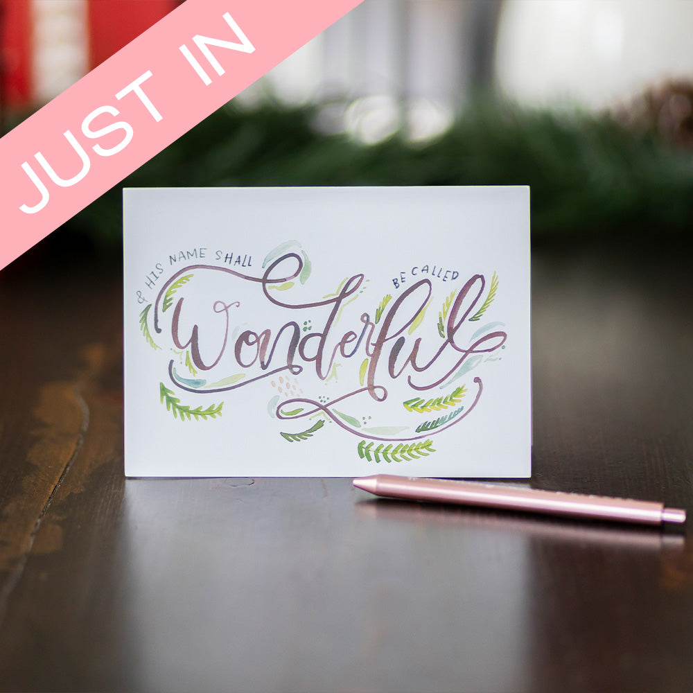 Christmas card standing up with "And His name shall be called wonderful" on cover with Just In banner.