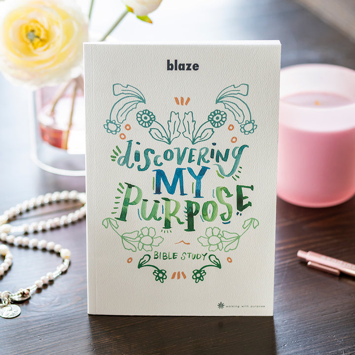 Discovering My Purpose Bible study on table with candle and flowers