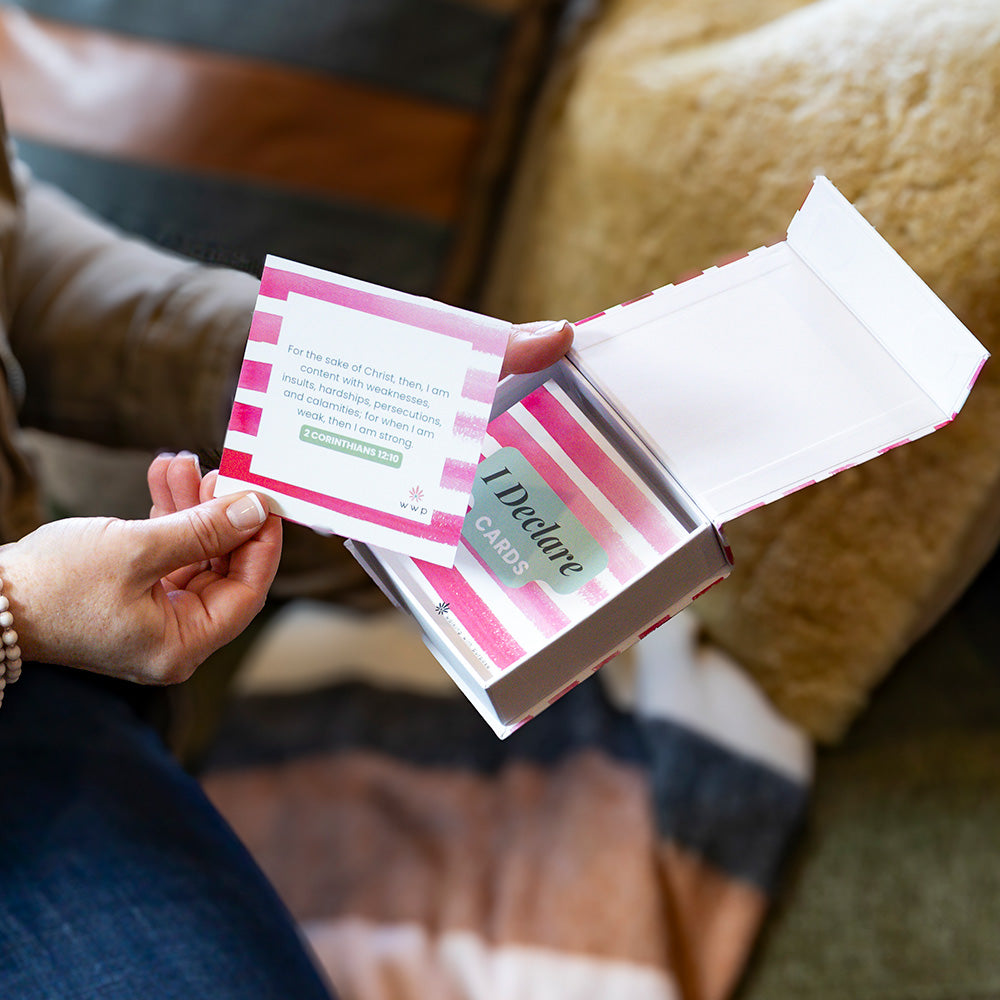 Woman holding box of 'I Declare' Scripture cards with one card out