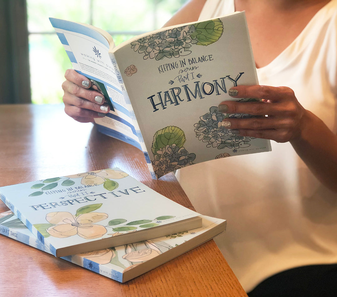 young woman holding Harmony Bible study