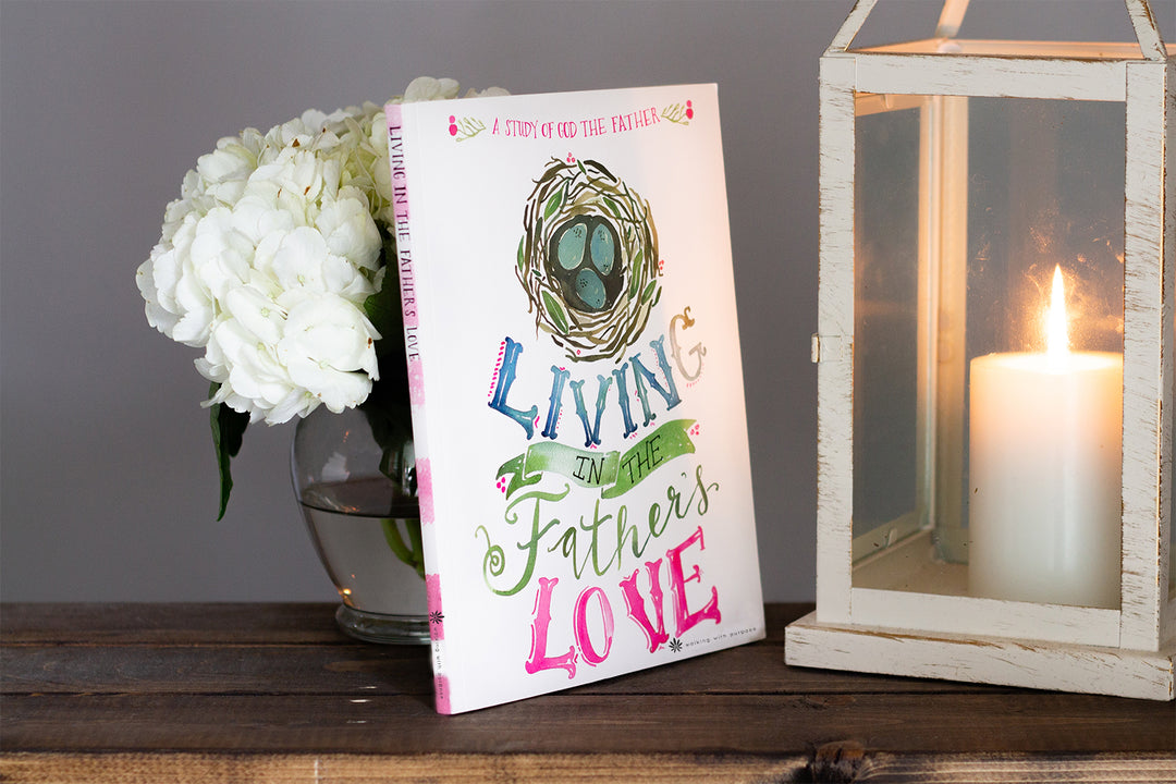 Living in the Father's Love Bible Study near a lamp and flowers