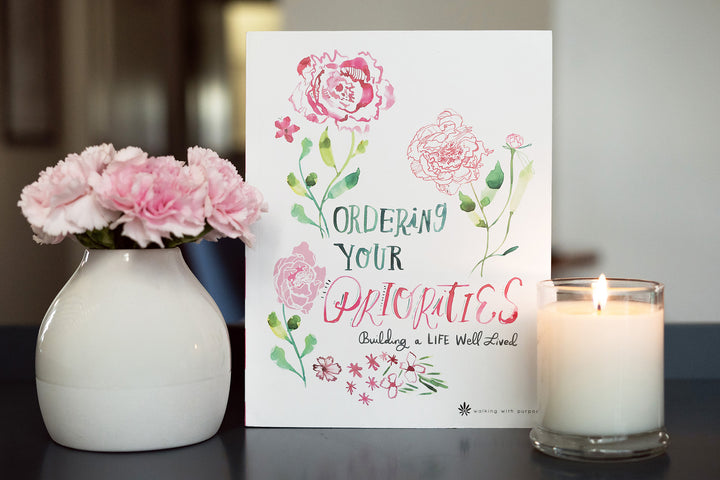 Ordering Your Priorities Bible Study with a candle and flowers