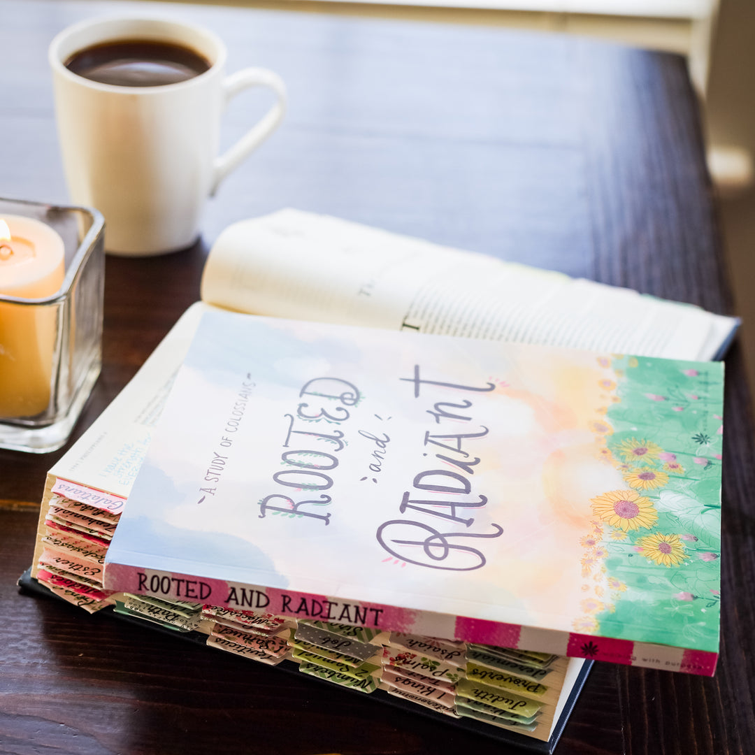 Rooted and Radiant study guide with open Bible