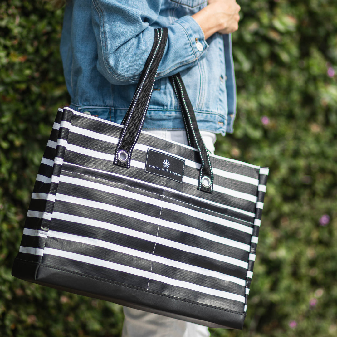 woman carrying WWP SCOUT Large Book Tote with Zip-top and Pockets