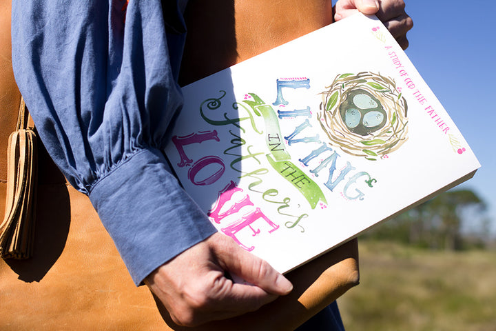 woman carrying Living in the Father's Love Bible Study