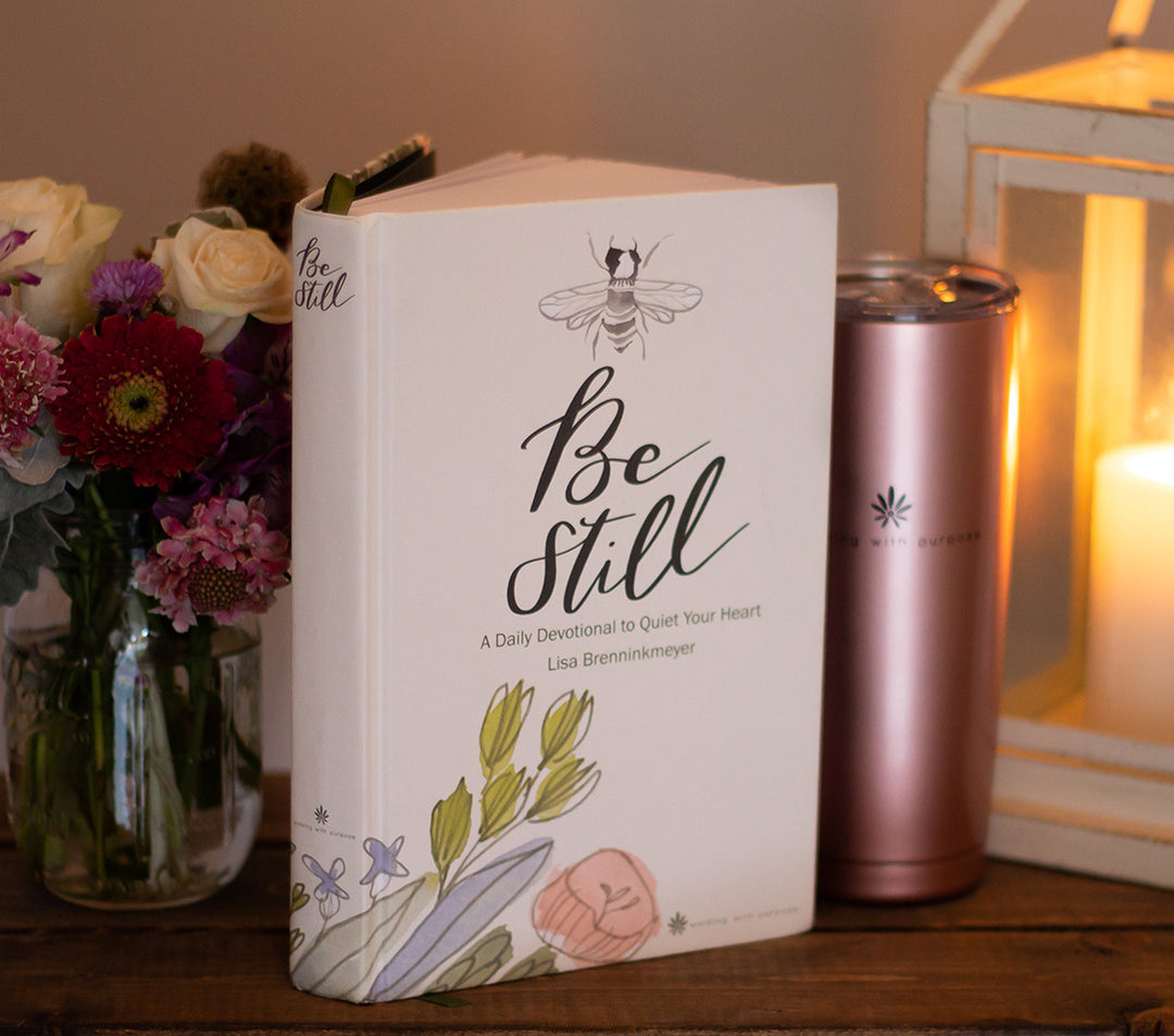 Be Still 365-Day Devotional to Quiet Your Heart standing beside WWP beverage container