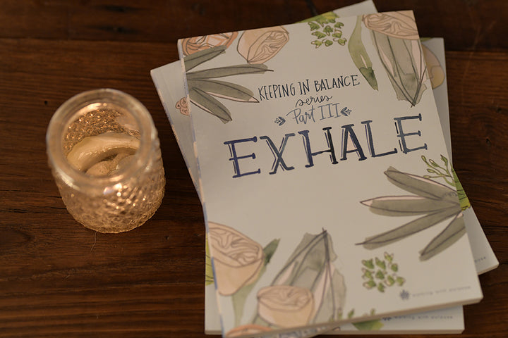 Exhale: Keeping In Balance Young Adult Series - Part III on a table with candle