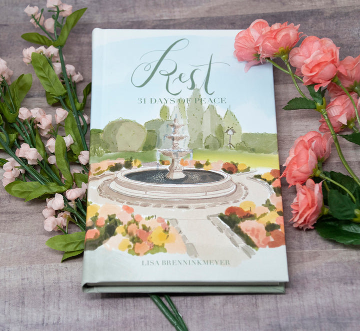 Rest Devotional on table with flowers